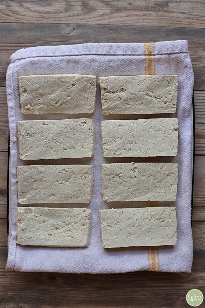 Slices of tofu on a plate.
