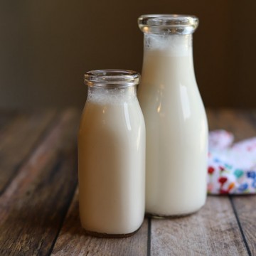 Two bottles of homemade almond milk.