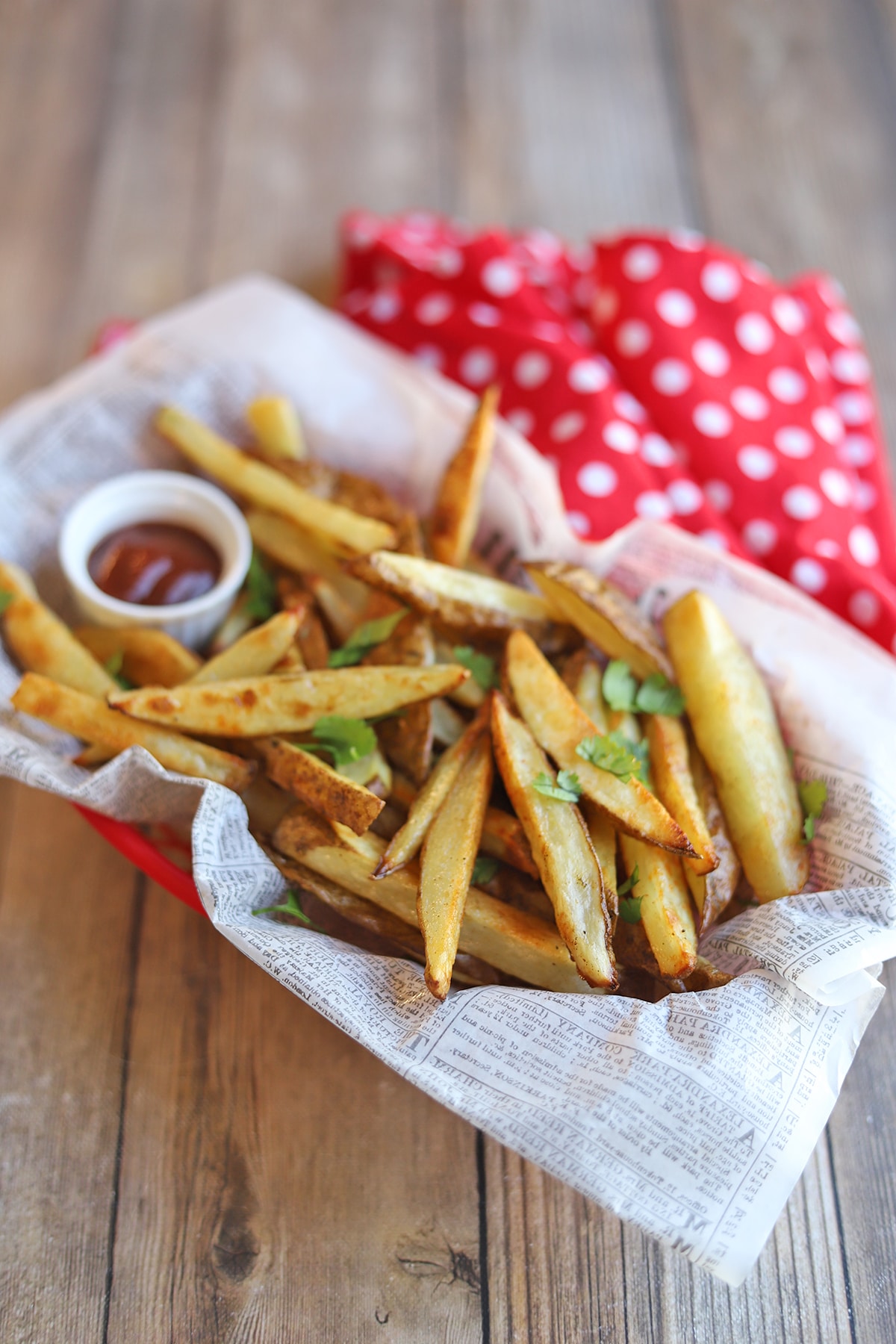 Basket of fries with ketchup.