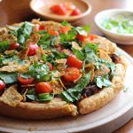 Black bean vegan taco pizza on cutting board.