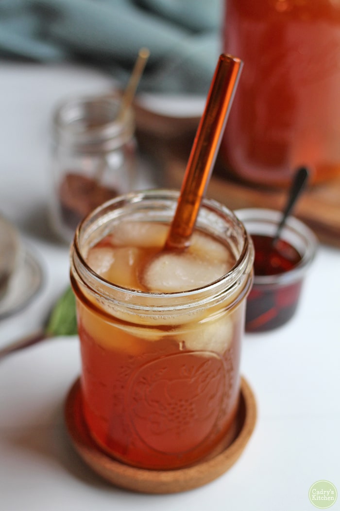 Glass of iced tea with peach juice.