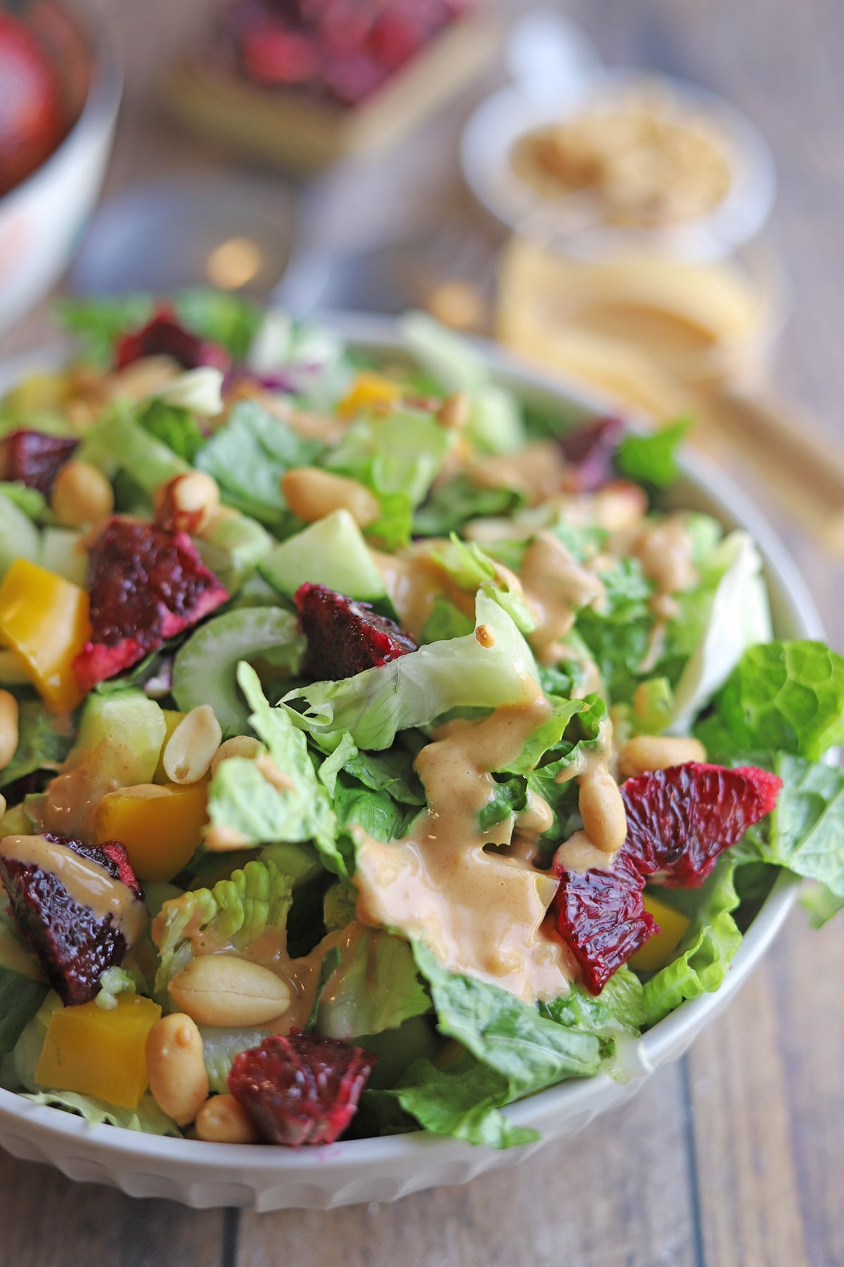 Close-up peanut dressing on salad.