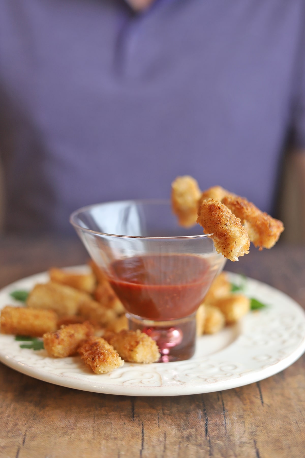 Vegan shrimp with cocktail sauce on plate.