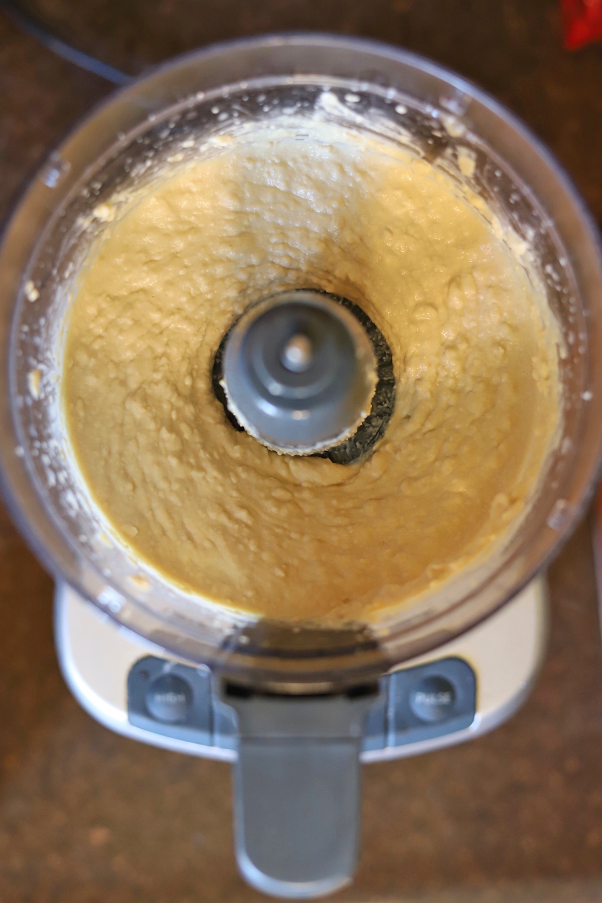 Blended chickpea hummus in food processor.
