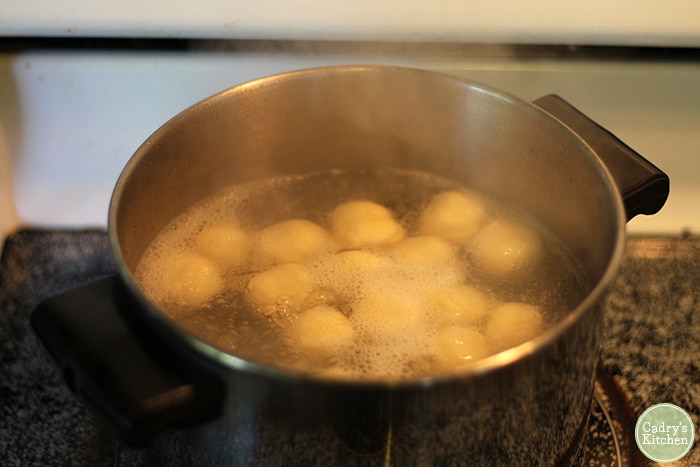 Gnocchi boiling in pot.