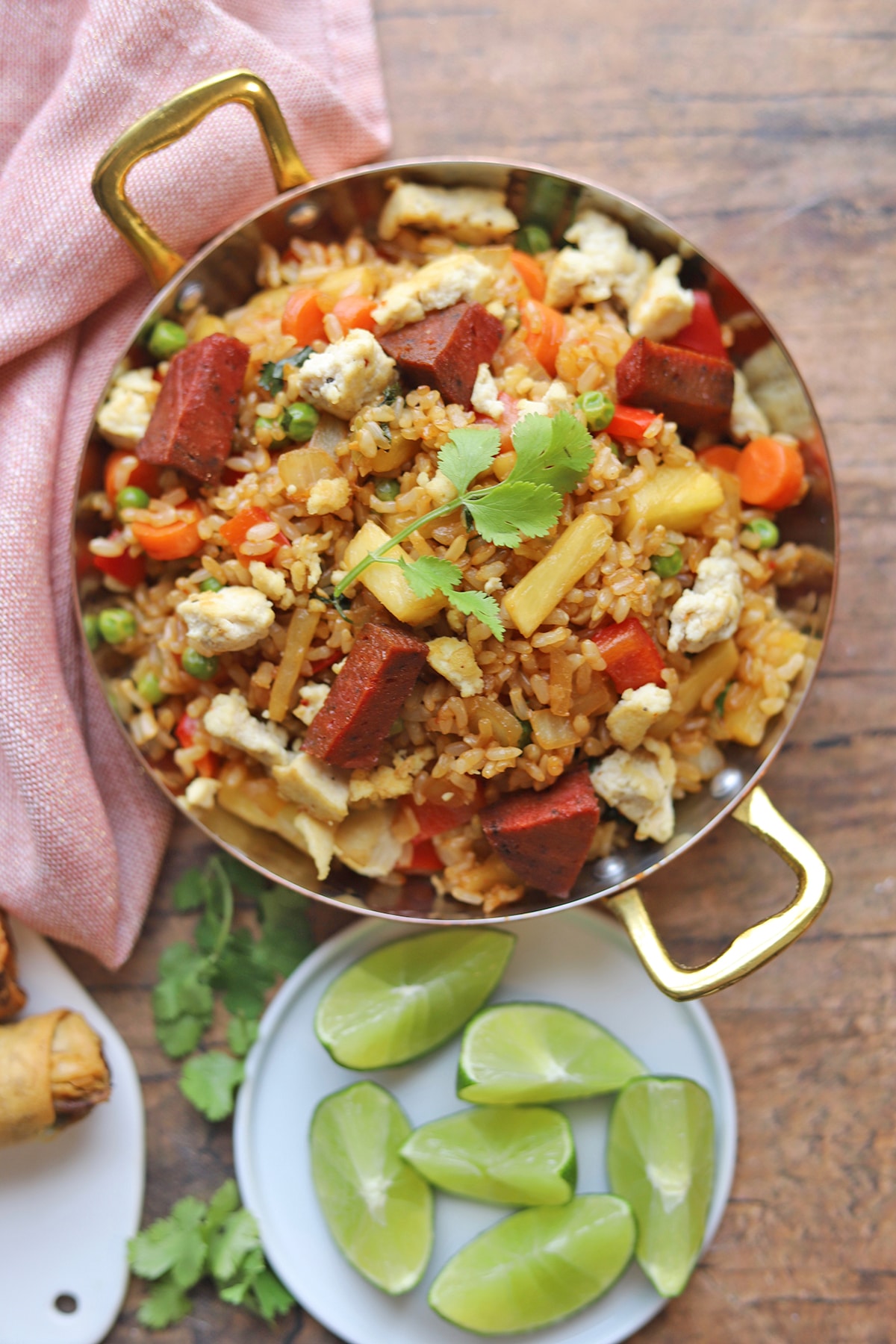 Overhead skillet with pineapple fried rice and seitan ham.