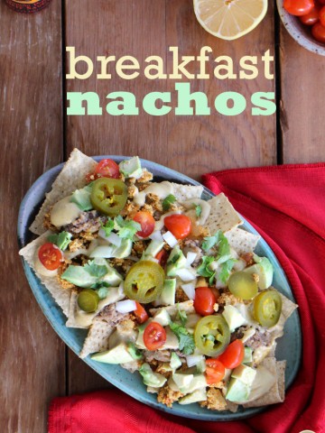 Text overlay: Breakfast nachos. Platter of nachos with red napkin.