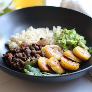 Black bean bowl with fried plantains and guacamole.