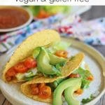Text overlay: Chickpea tacos. Vegan & gluten-free. Two tacos on plate.