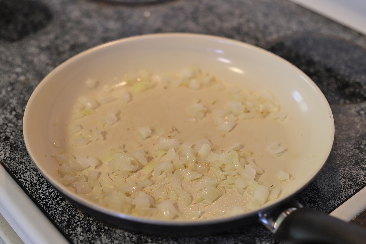 Sauteed onions & garlic in a skillet.