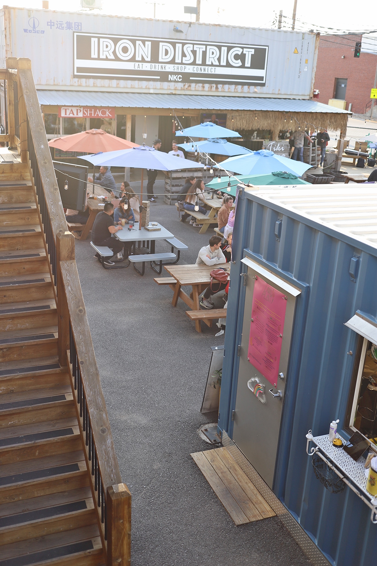 Shipping containers and tables at Iron District.