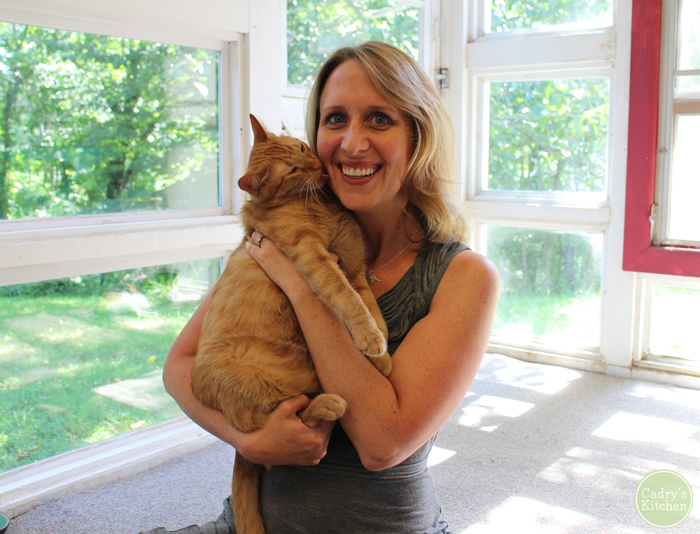 Cadry holding Avon as a full grown cat.