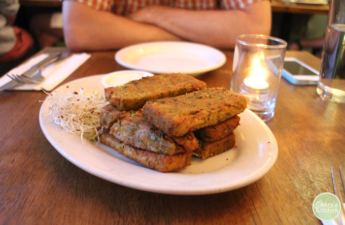 Stack of chickpea fries on plate.