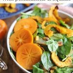 Text overlay: Spinach salad with persimmons and squash. Bowl of salad with sliced persimmons.