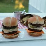 Vegan Big Mac sliders on plate with french fries.