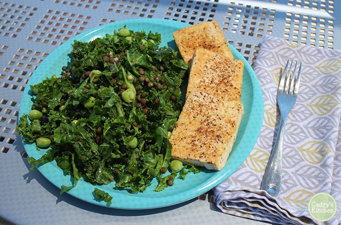 Kale salad and slabs of tofu with Cajun seasoning.