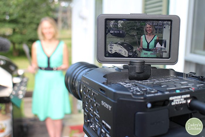 Food blog pet peeves. Cadry in front of a video camera by a grill.