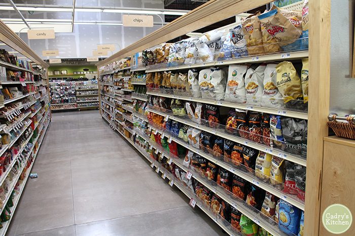 Hy-Vee health market with bags of potato chips on shelves.