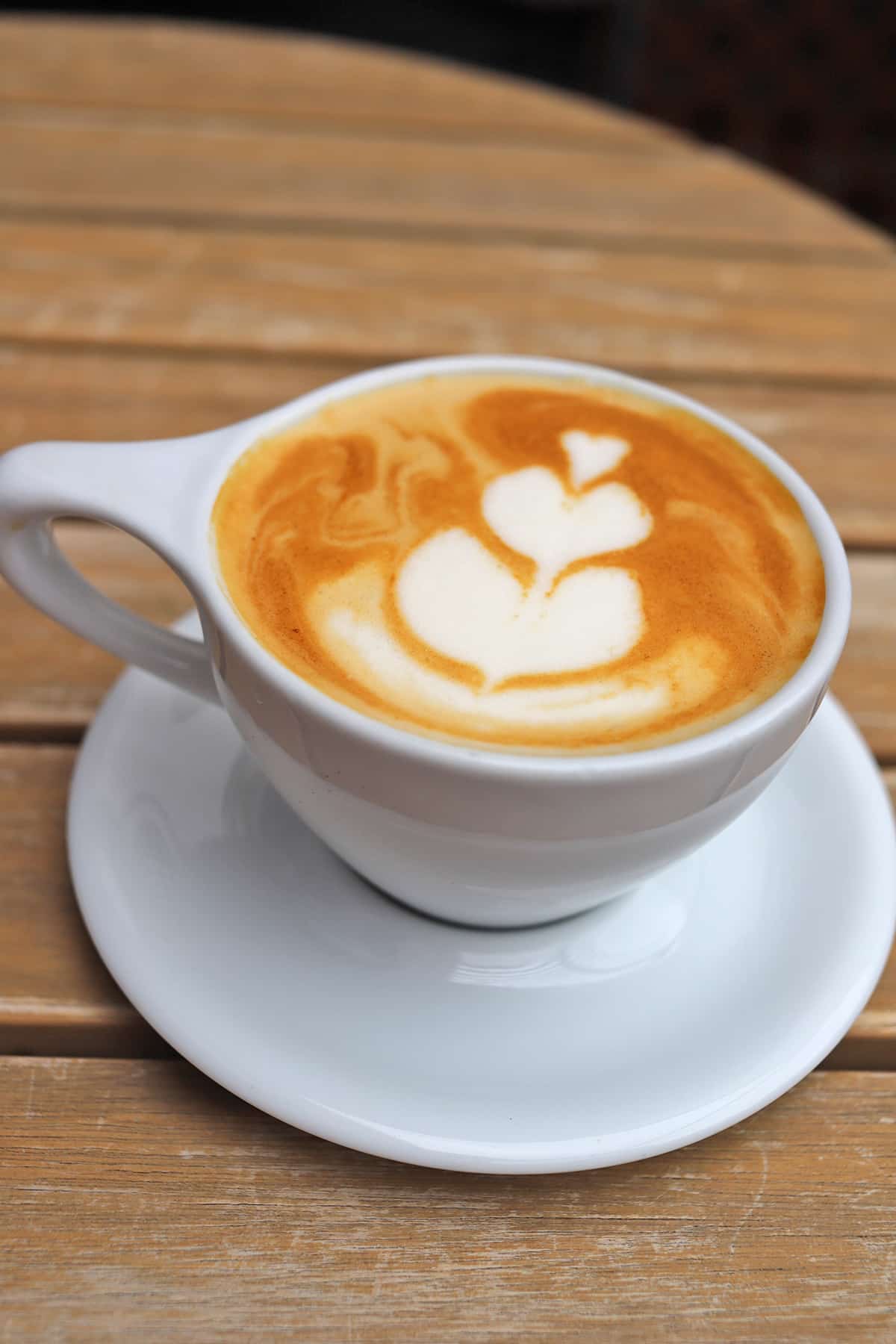 Vegan latte with foam flower.