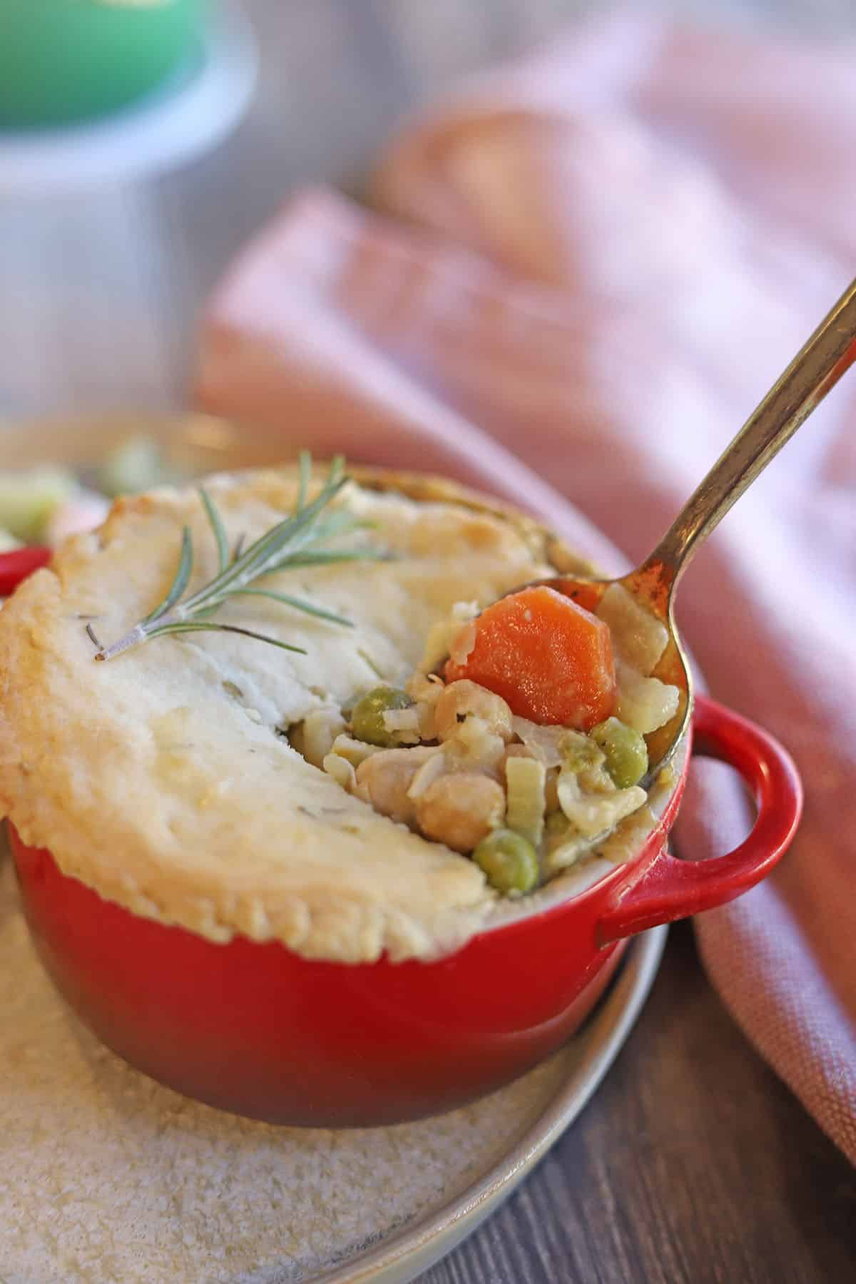 Filling being spooned out of veggie pot pie.
