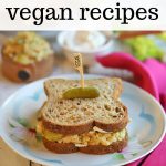 Text overlay: 40 easy vegan recipes. Chickpea salad sandwich on plate.