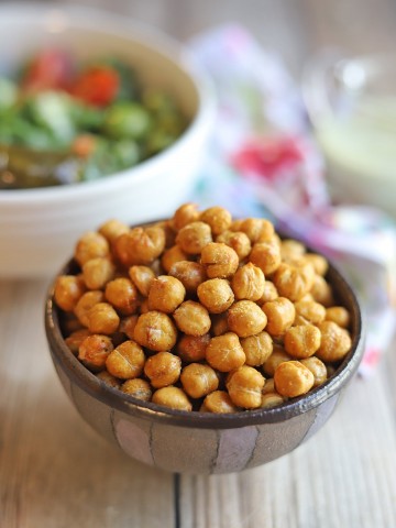 Fried chickpeas in bowl on table.