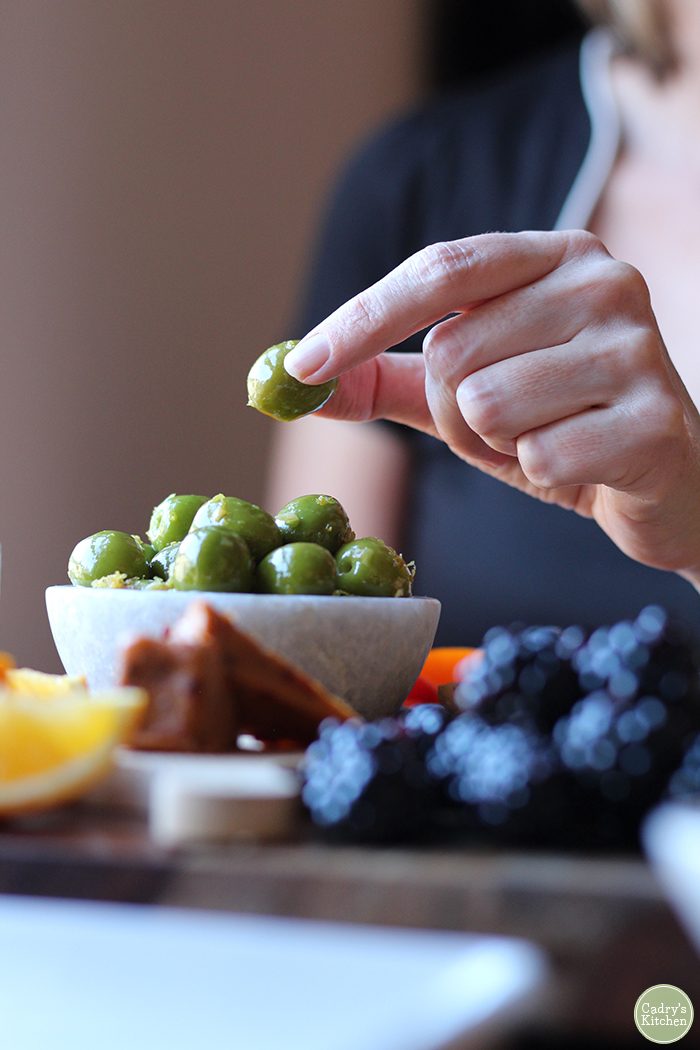 Warmed castelvetrano olives with lemon & garlic: A beautiful vegan, gluten-free appetizer | cadryskitchen.com