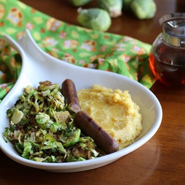 Calling savory breakfast lovers! This protein-packed breakfast will really stick with you. Creamy polenta, Brussels sprouts, and vegan sausages. Just add a drizzle of maple syrup! | cadryskitchen.com