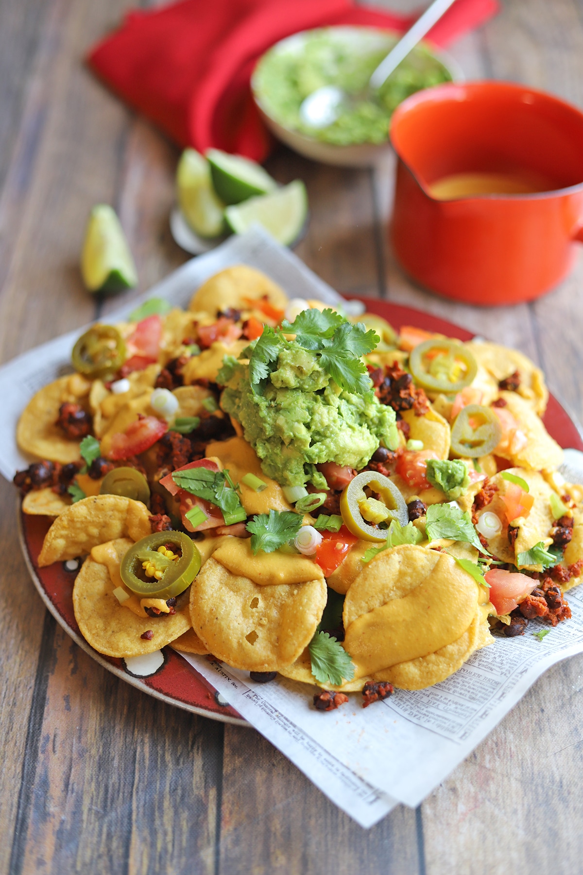 Platter of nachos by cashew queso.