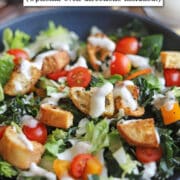 Text overlay: Air fryer croutons. Optional oven directions included. Salad with croutons and ranch dressing in bowl.