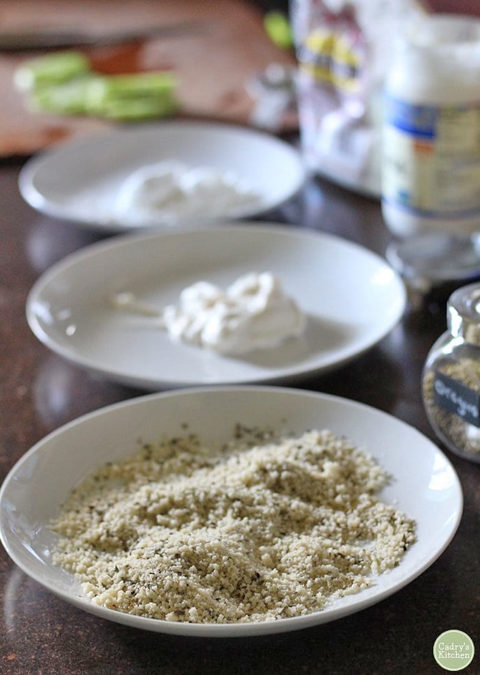 Work station with bread crumbs, mayonnaise, and cornstarch.
