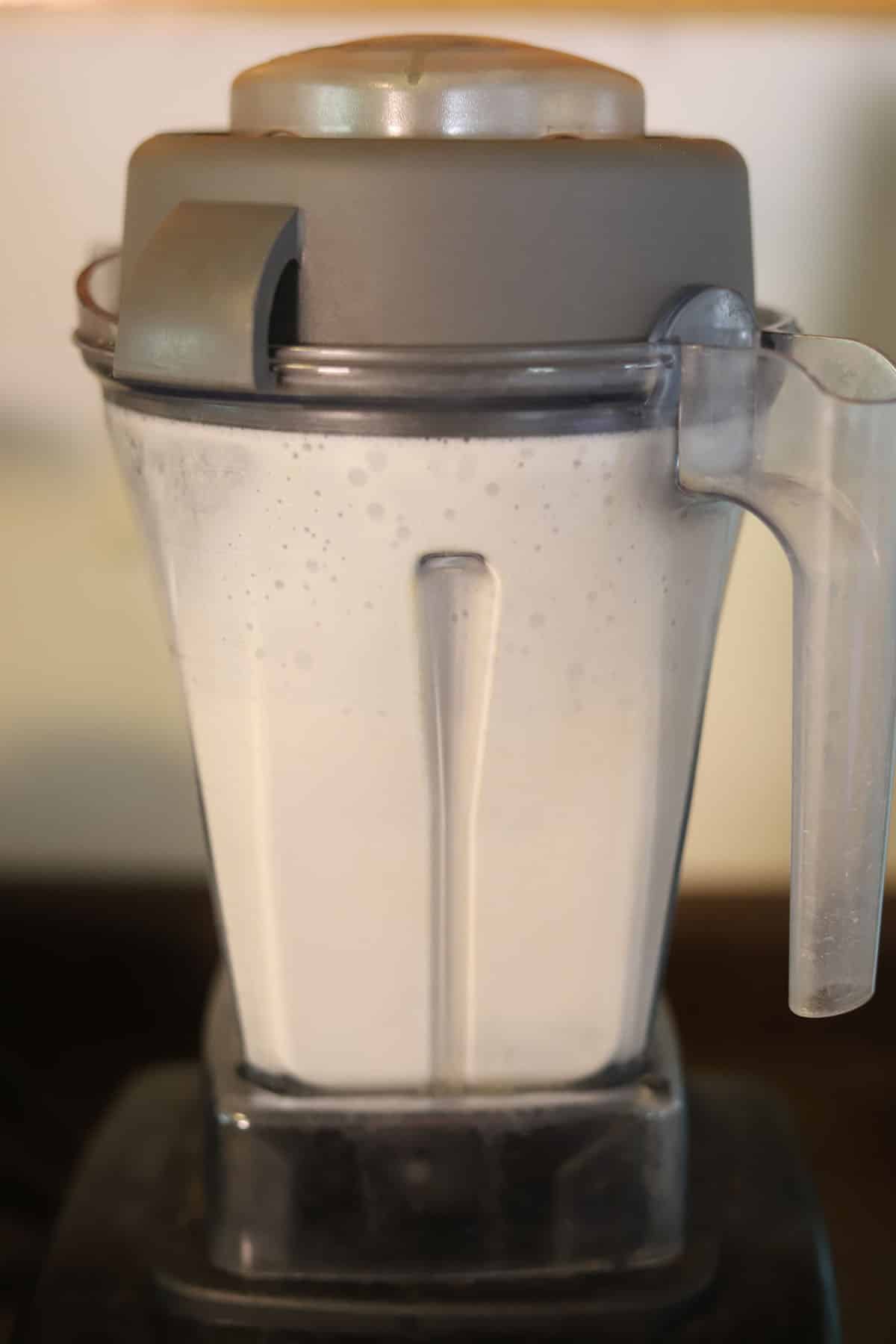 Cashew cream in Vitamix blender pitcher.