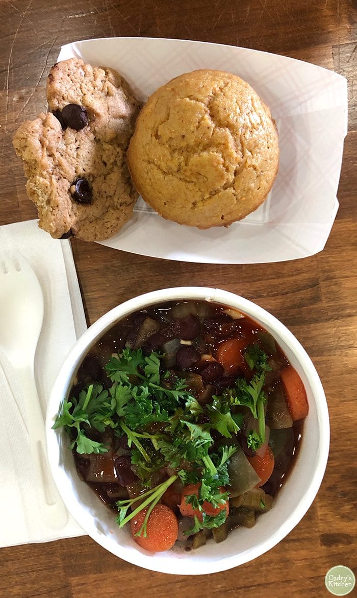 Overhead picture red bean & rice bowl with cornbread muffin & chocolate chip cookie.