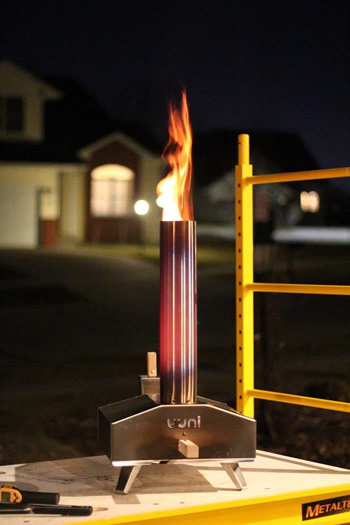 Uuni outdoor pizza oven with flames.