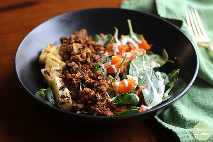 Spinach salad with Herbivorous Butcher jackfruit & grilled pineapple.