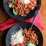 Vegan burrito bowl with cauliflower rice, brown rice, pico de gallo, and spicy chickpeas.