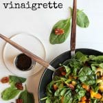 Overhead easy spinach salad with balsamic vinaigrette + text.