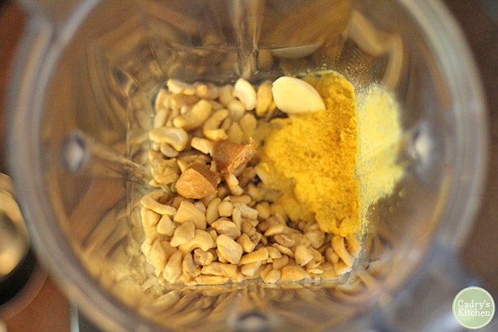 Cashews, nutritional yeast flakes, garlic, and miso paste with water in blender.