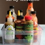 Hot sauce collection in basket + text that says 3 top hot sauces in my kitchen.