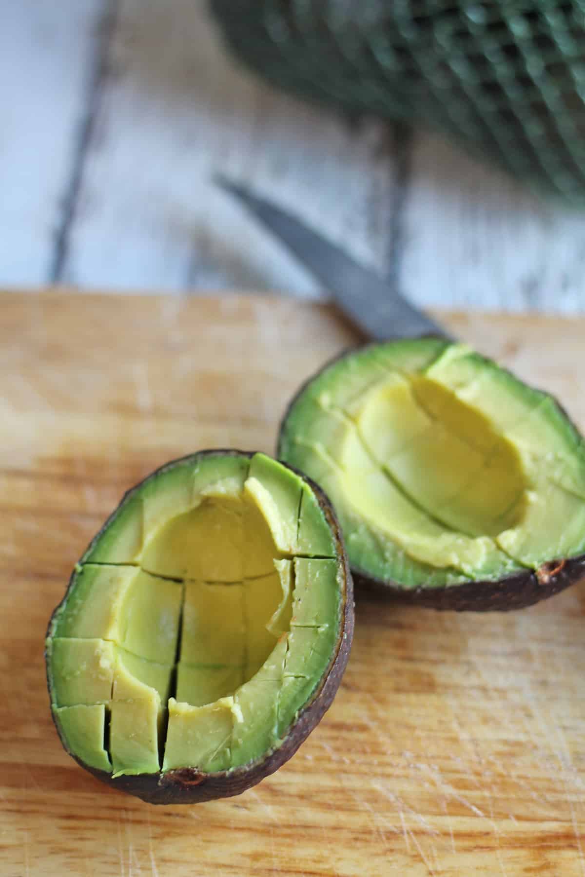 Avocado that has been scored with a knife.