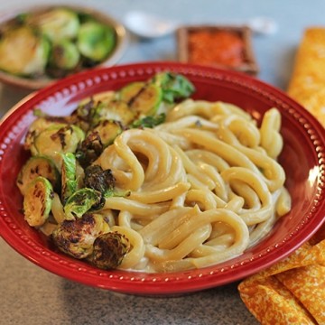 Udon noodle bowl with cashew cheese sauce & Brussels sprouts.