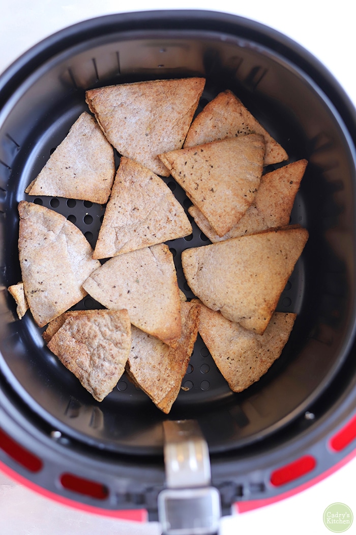 Overhead toasted wedges of pita bread in air fryer.