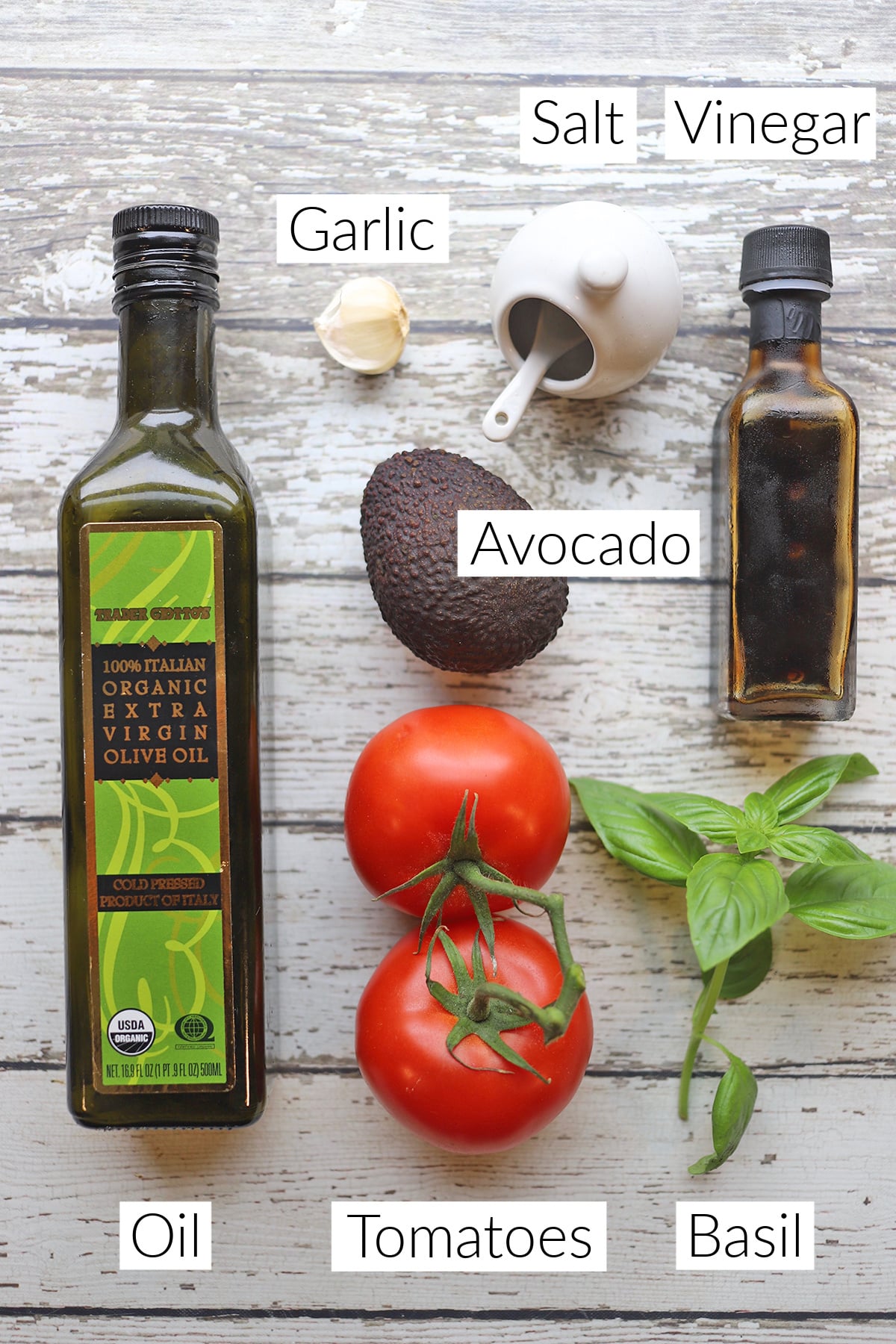 Labeled ingredients for avocado caprese salad.