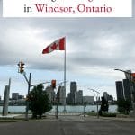 Text: Where to go for vegan food in Windsor, Ontario. Detroit River & Canadian flag.