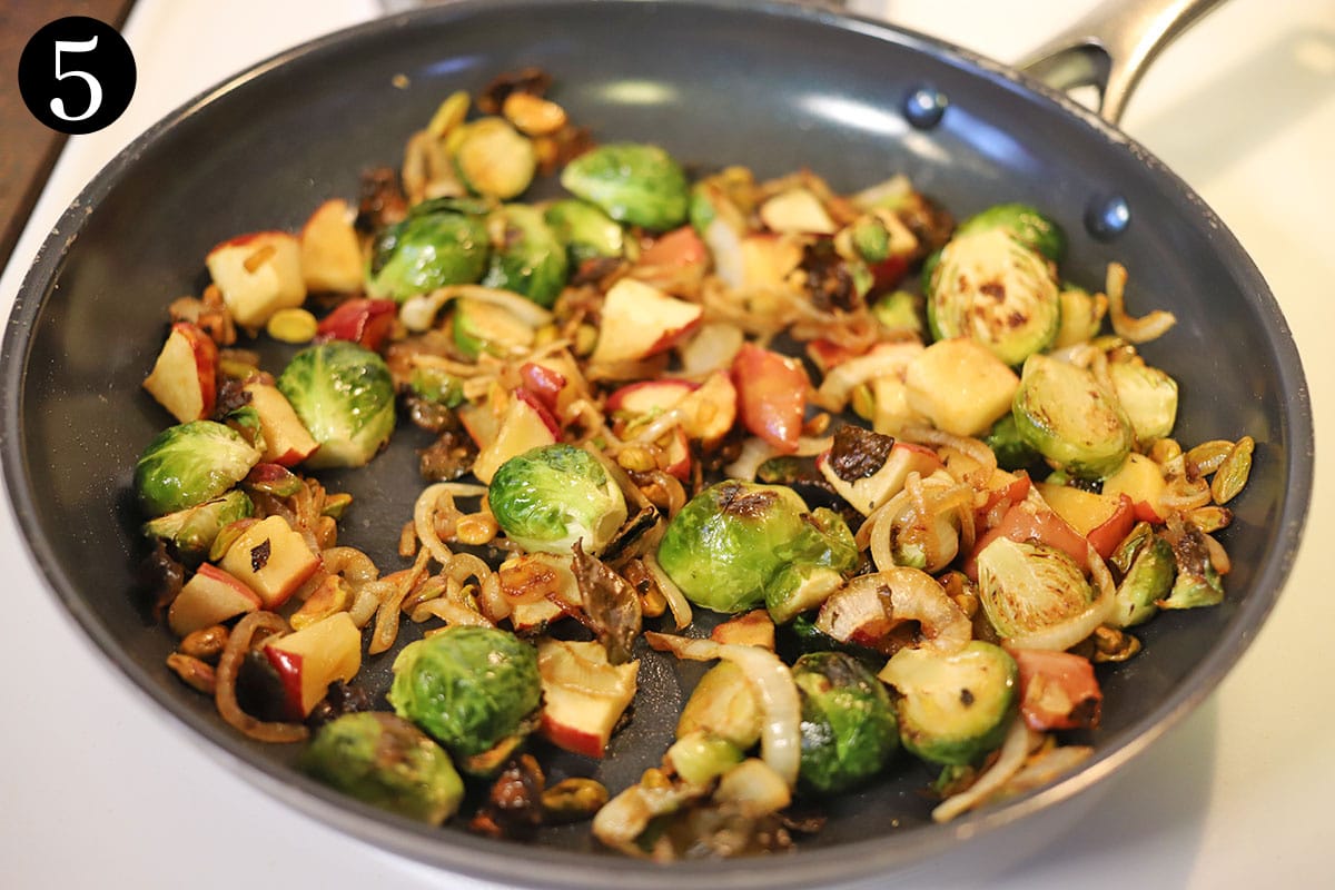 Skillet with roasted Brussels sprouts, apples, and caramelized onions.