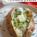 Text overlay, air fryer baked potato. Jacket potato on plate with pat of non-dairy butter.