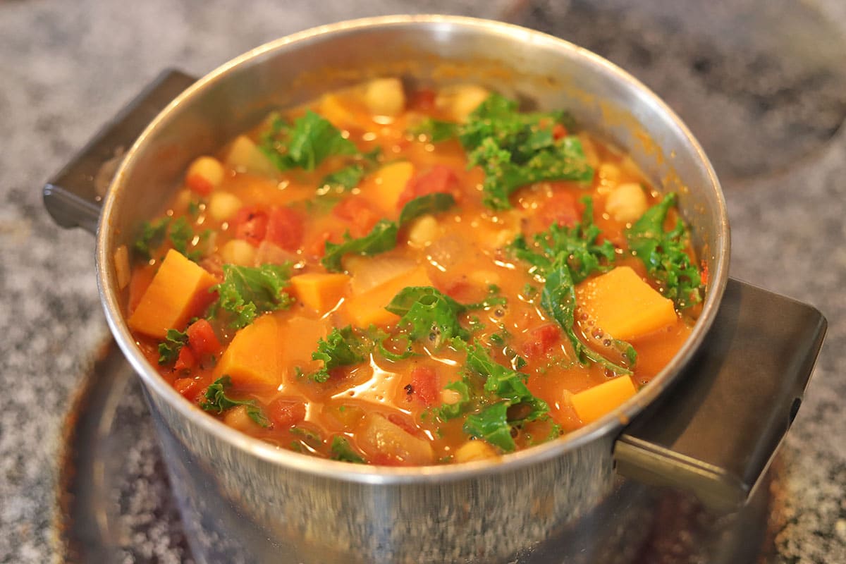 Kale added to top of sweet potato peanut stew.
