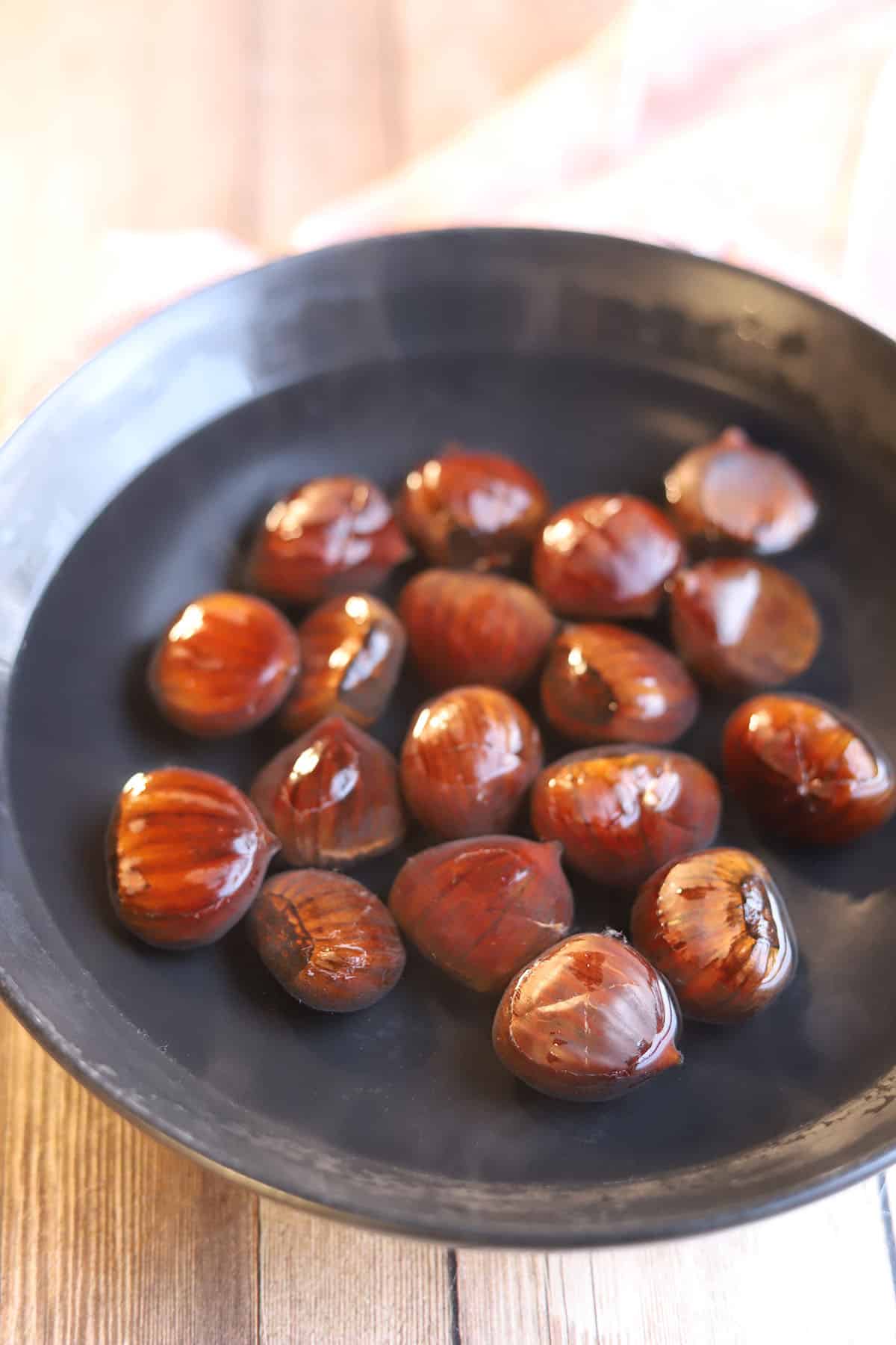 Chestnuts soaking in a bowl of water.