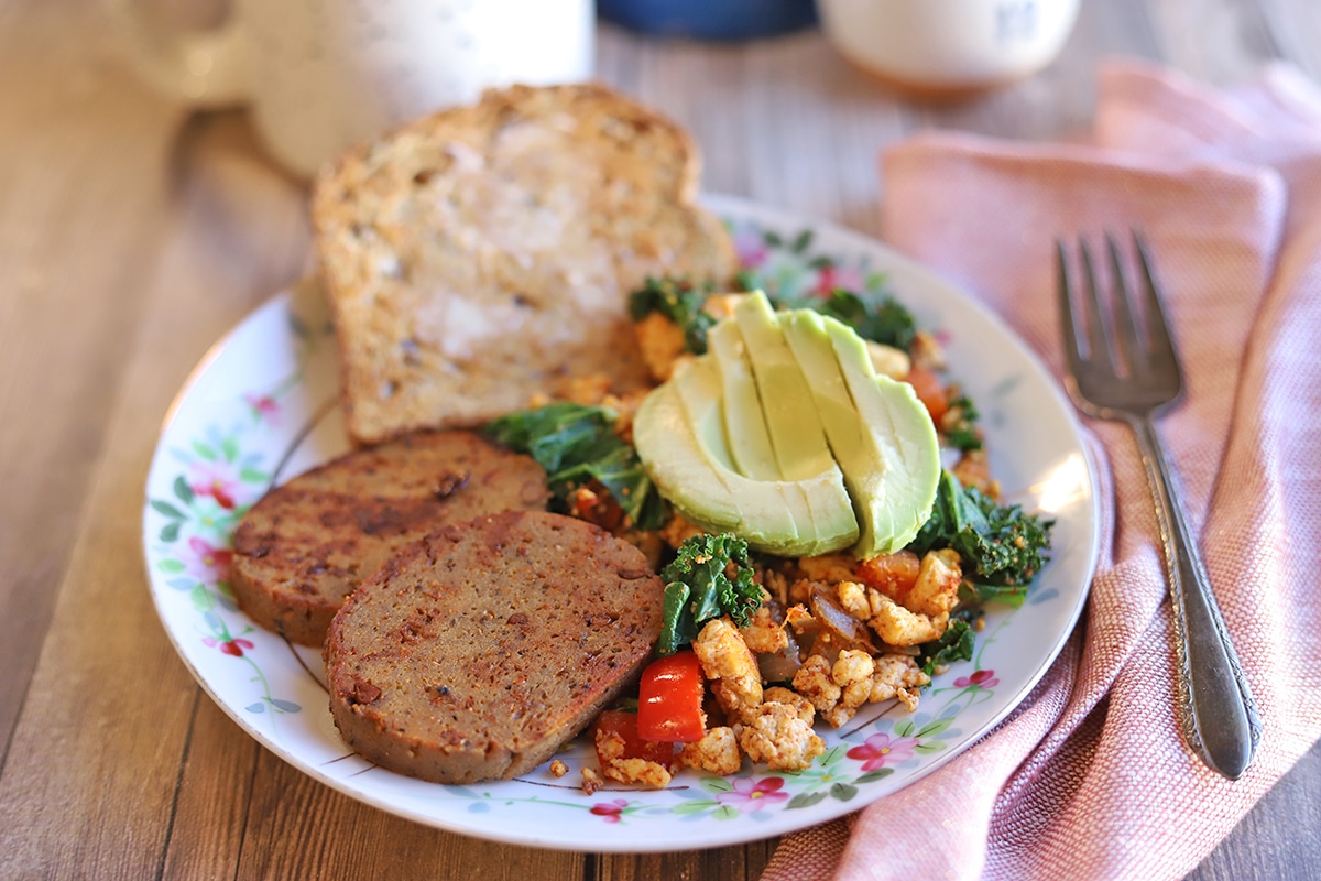 Breakfast plate with maple mustard sausage, toast, and tofu scramble.