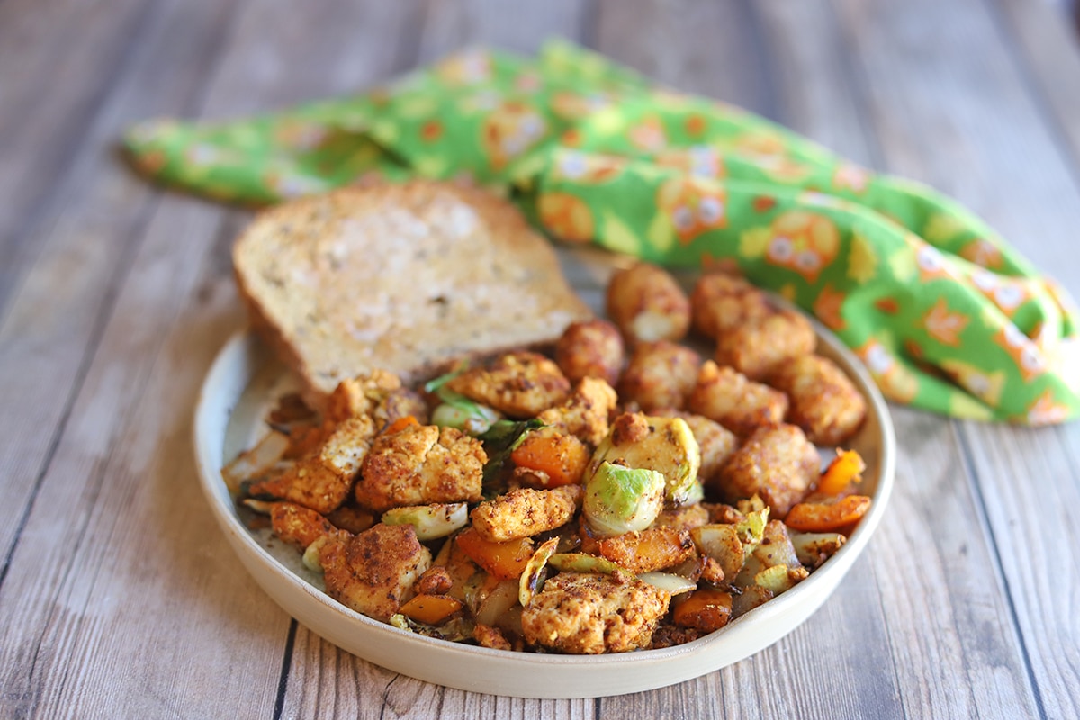 Tofu scramble with Brussels sprouts, toast, and tater tots.